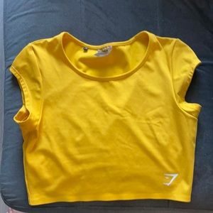Bright yellow Gymshark workout top